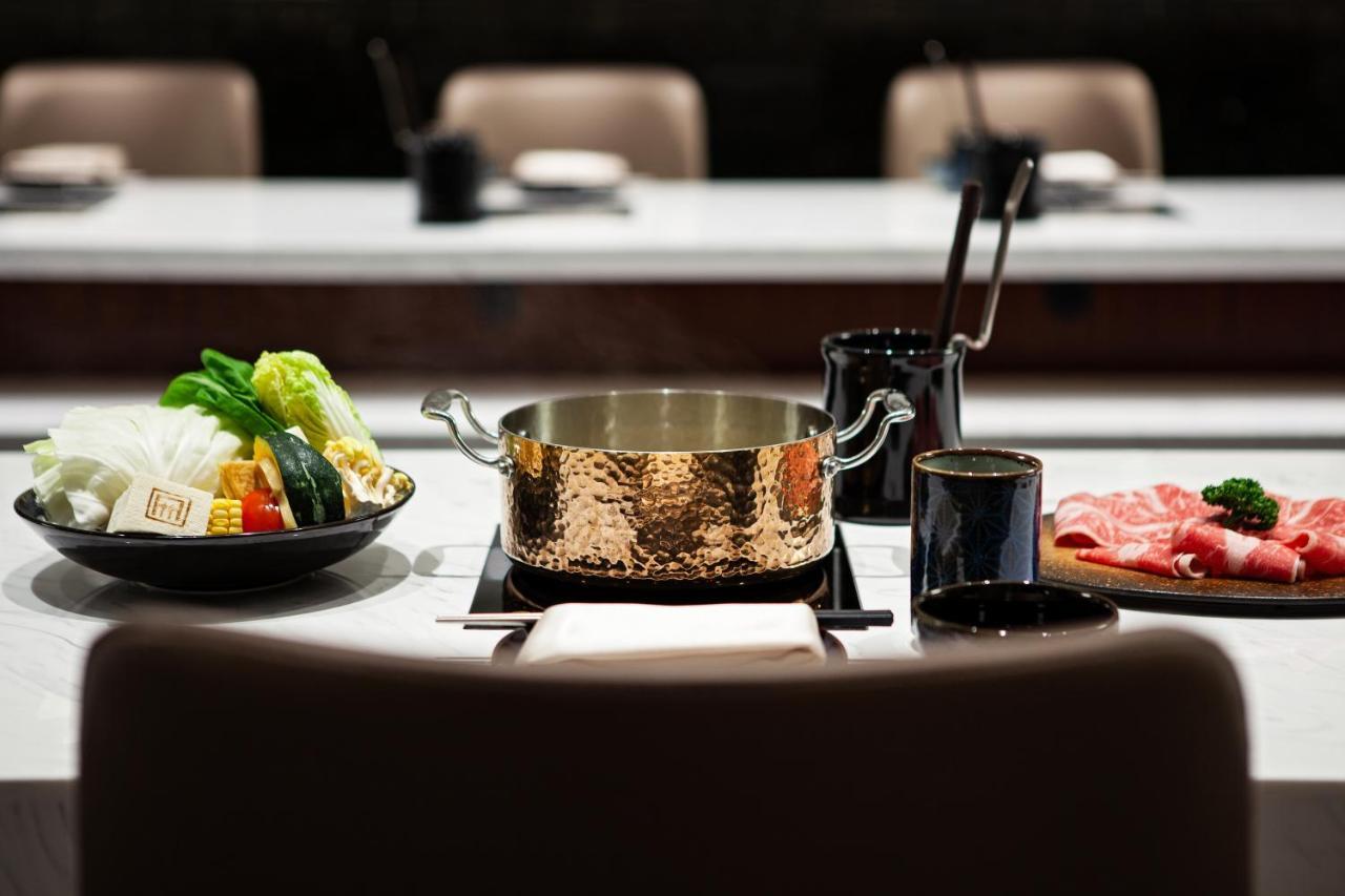 Ambassador Hotel Hsinchu Bagian luar foto A pot of consommé
